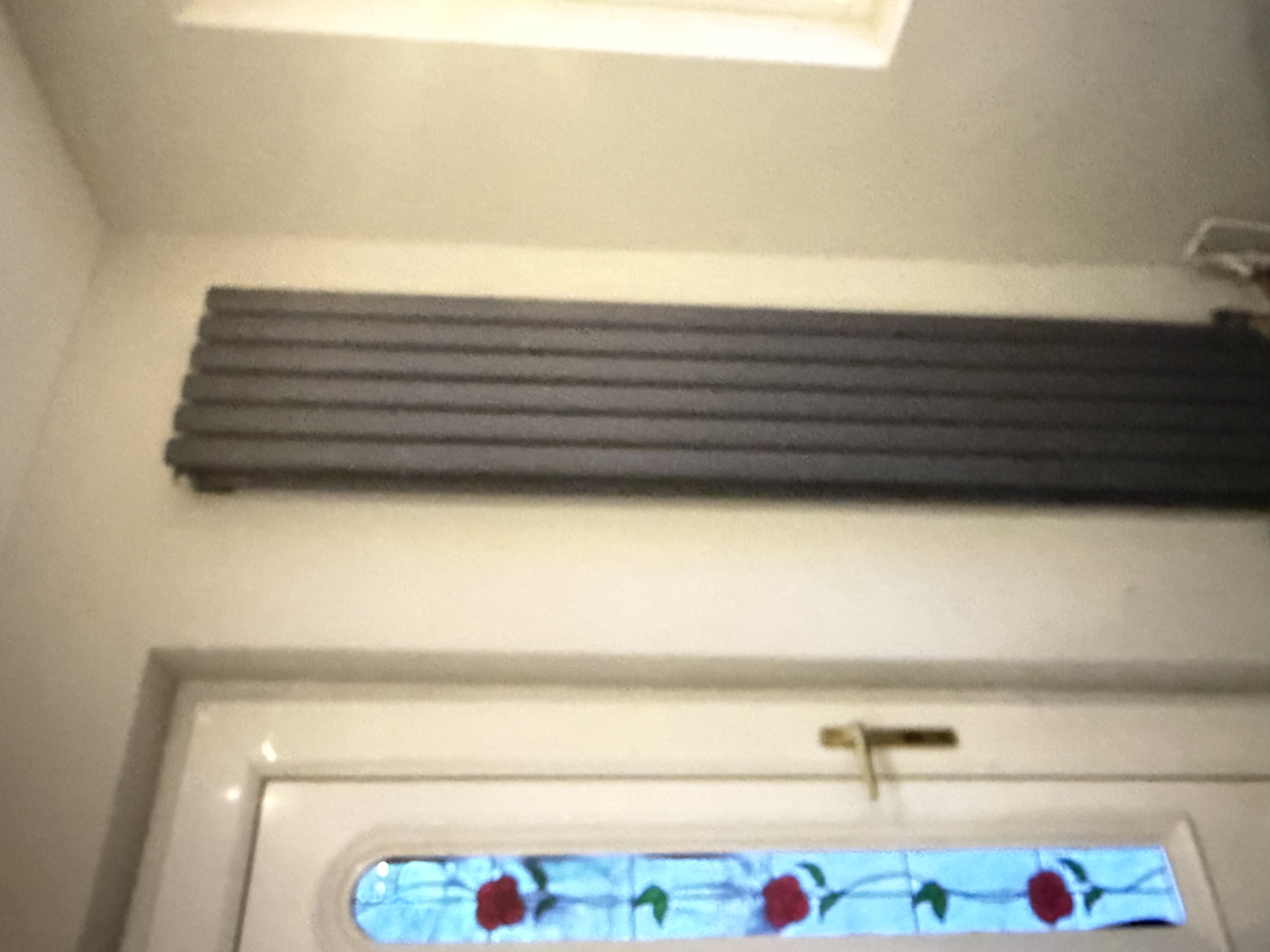 Anthracite designer radiator above door
